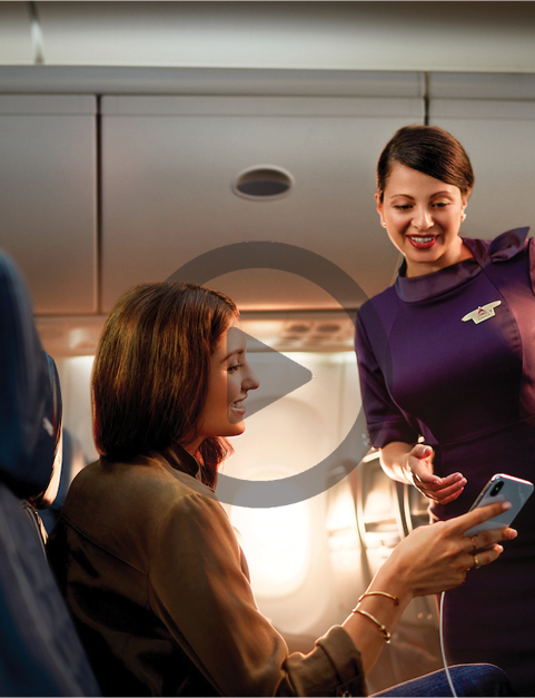 Woman and flight attendant